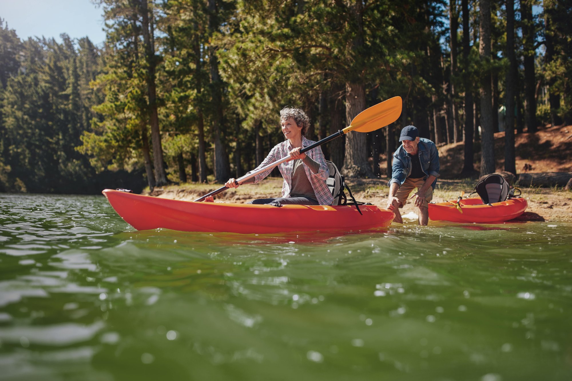 Couple going kayaking energetically